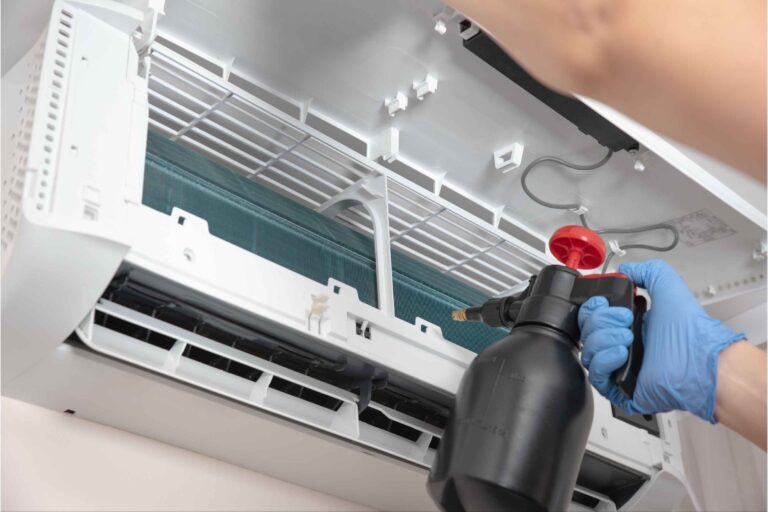 Air conditioning chemical cleaning service in Singapore, showing a technician performing a thorough cleaning of an aircon unit for optimal performance.