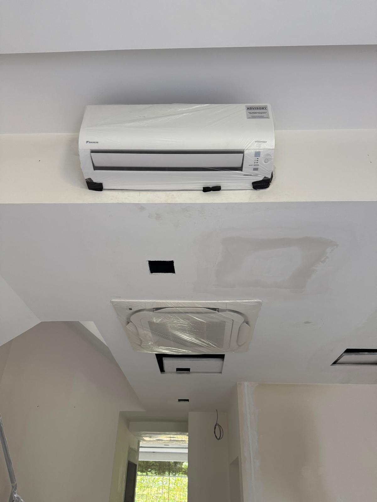 Condensate drain with correct downhill slope to prevent leaks in HDB flat